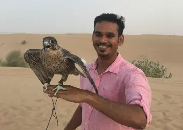 Photo with Falcon on Dubai Desert with Oberon Tours